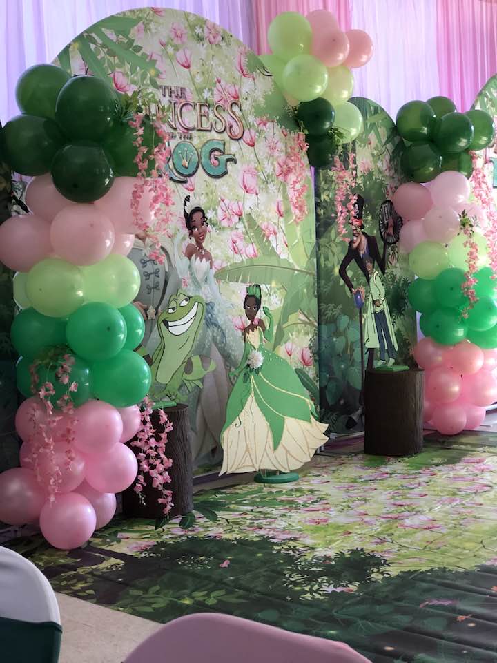 princess and the frog party decor with green and pink color scheme